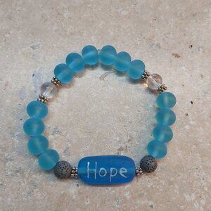 Handmade Hope lampwork glass bead with frosted glass and lava beads for aroma